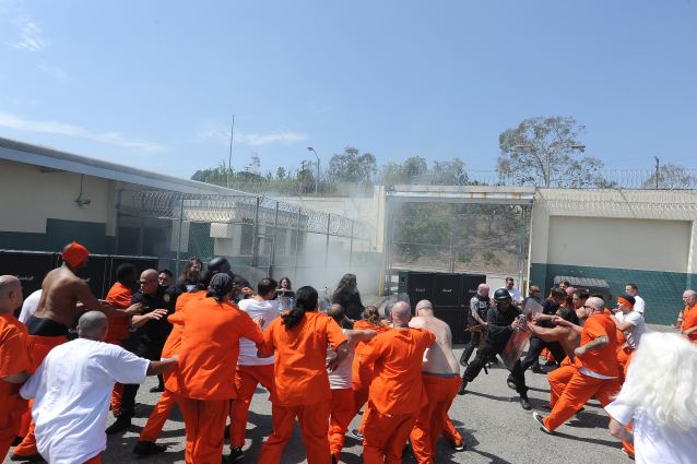 Slayer shoots its music video for the new track "Repentless."  Shot on August 26, 2015 at the Sybil Brand Institute in Los Angeles. Prisoners start to riot as Slayer performs. BAND L-R:  Gary Holt, drummer Paul Bostaph, Tom Araya, Kerry King